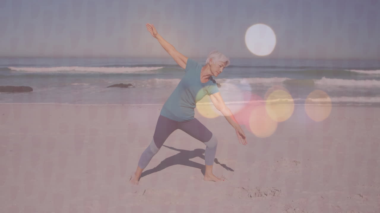 Practicing yoga on beach, senior woman with colorful animation light effects overlay