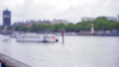 Coronavirus-safety-sign-for-social-distancing-by-London-Thames-river,-post-lockdown,-with-Big-Ben-and-Westminster-in-the-background