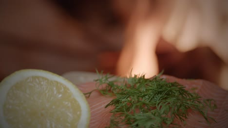 close-up-of-a-Salmon-next-to-a-campfire-with-lemon-and-herbs