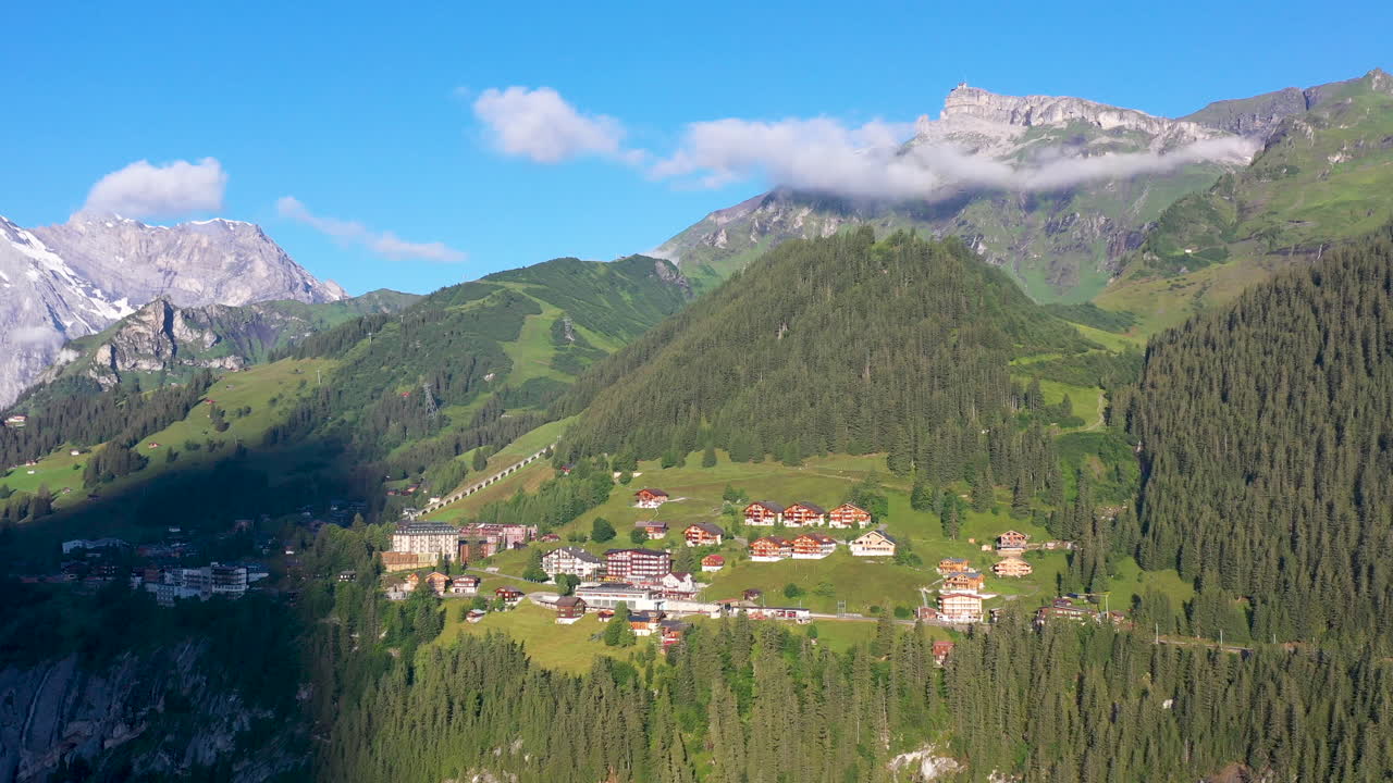 Wide rotating drone shot of Murren, a traditional Walser mountain village in the Bernese Highlands of Switzerland