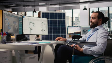 man with paraplegia in inclusive rd office designs green technology solar panels