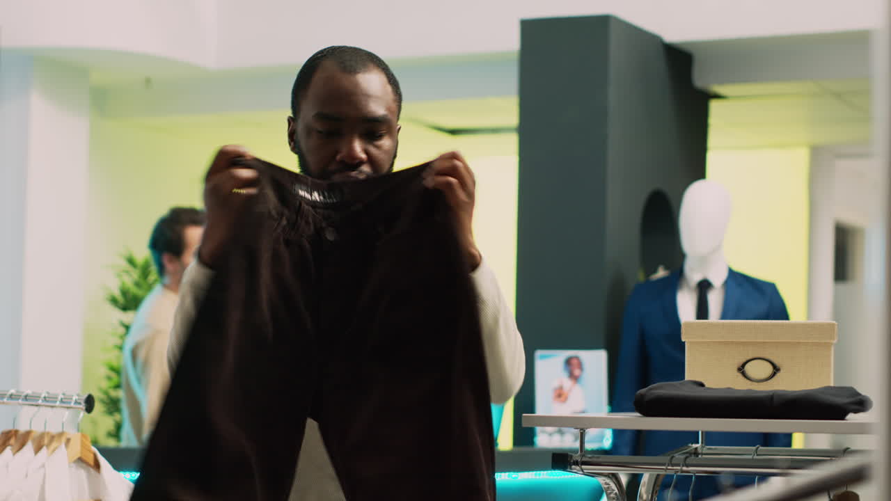 Man shopping for clothes at retail store