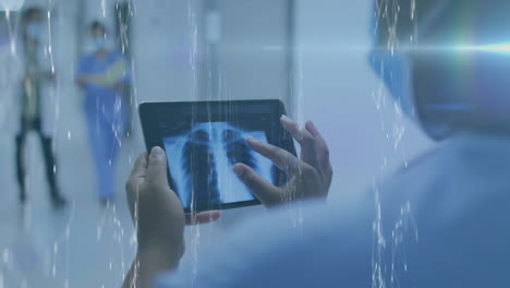 doctor examines x-ray on tablet amid molecular structures, highlighting medical tech.