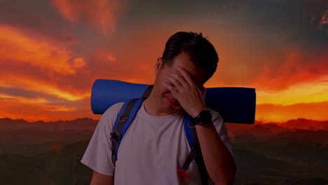 man with headache on a hike