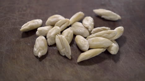 A-closeup-pan-of-Galip-nuts-on-a-wooden-table