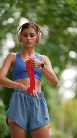 woman exercising with resistance band outdoors