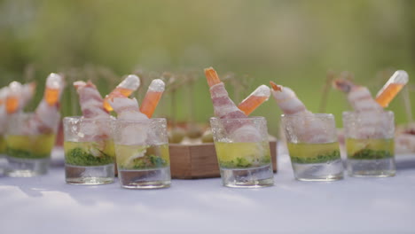 catering-service-in-open-air-event-closeup-view-of-table-with-delicious-appetizers-and-snacks