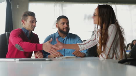 confident business people talking and shaking hands at office.