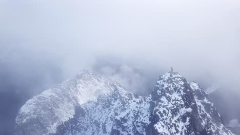 hikers standing on top of a peak in the coast mountains of canada