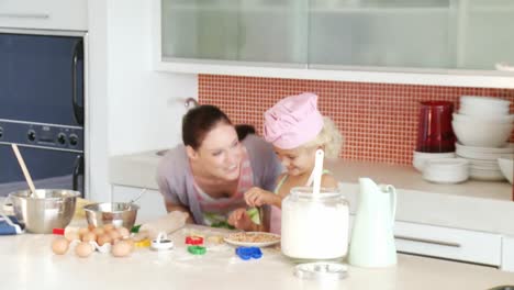 mother and daughter baking together