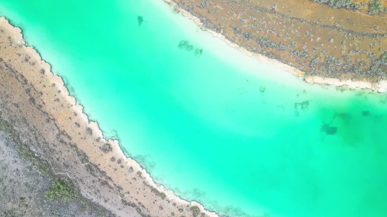 Aerial view of turquoise lagoon in Bacalar, Mexico, peaceful and serene