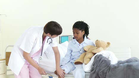 female doctor examining a patient