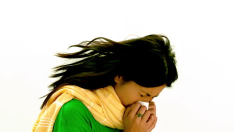 Asian-lady-in-green-tshirt-and-yellow-scarf-sneezing