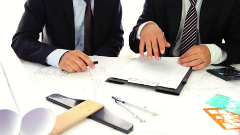 Businessman-In-Suit-And-His-Male-Business-Partner-In-Glasses