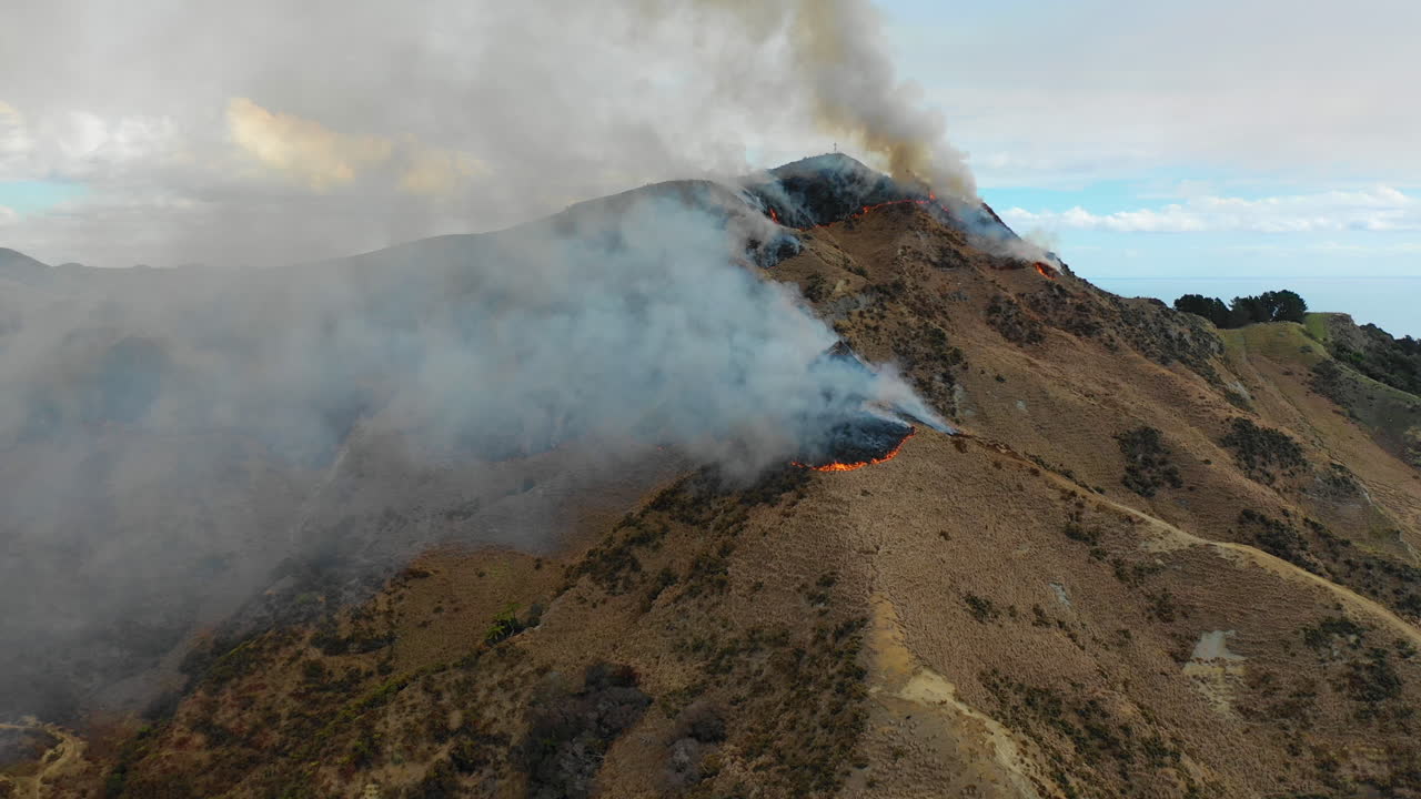 Bushfires blaze on the hilltops of New Zealand's North Island, aerial view
