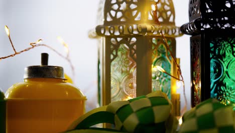 arabic lantern and ribbon ketupat on green background