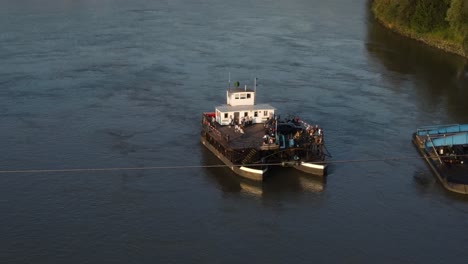 a cabe ferry crossing the danube in ottensheim