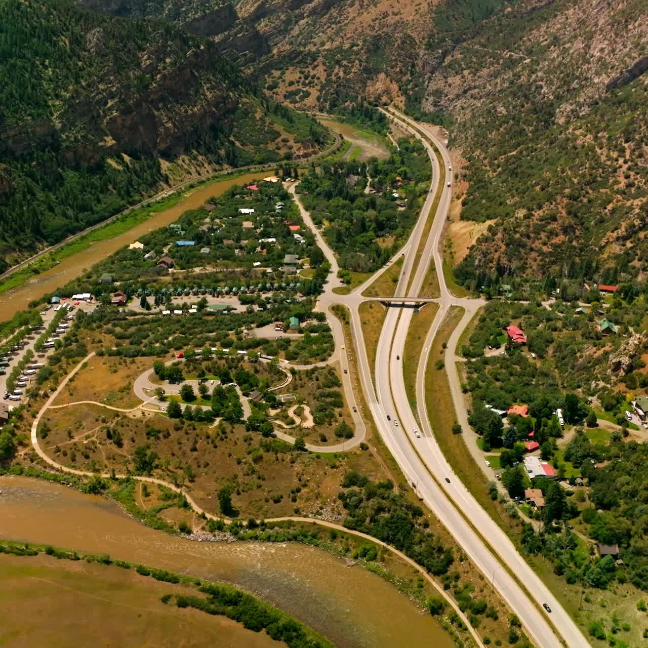 Delightful scenery of resort town in the mountains. Beautiful town locating between the river and speed highways. Top view