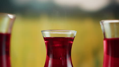 close-up of red beverage in elegant glasses