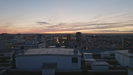 a panoramic aerial shot capturing the sparkling district against paris's night s