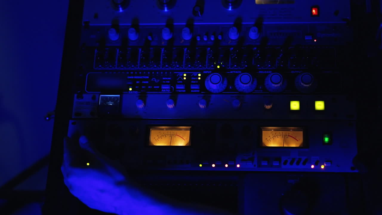 Audio Engineer Working in a Recording Studio at Night