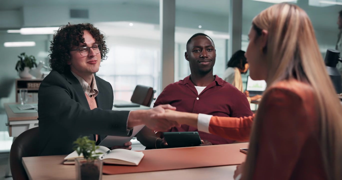 Diverse Business Team Shaking Hands During Office Meeting