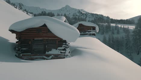 drone nature footage of freshly snowed mountain huts in south tyrol