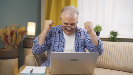 Man-joyfully-embracing-laptop.