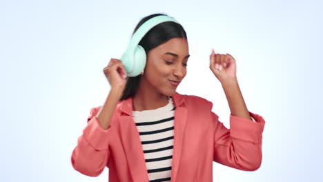 headphones, dancing and young woman in a studio