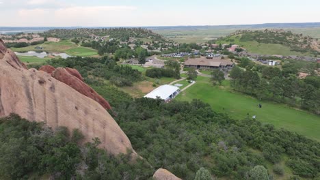 drone scenic view over red rock, wedding venue and small settlement in arrowhead, colorado, usa