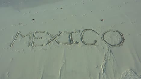 mexico inscribed in the sand on a beach with parallax effect