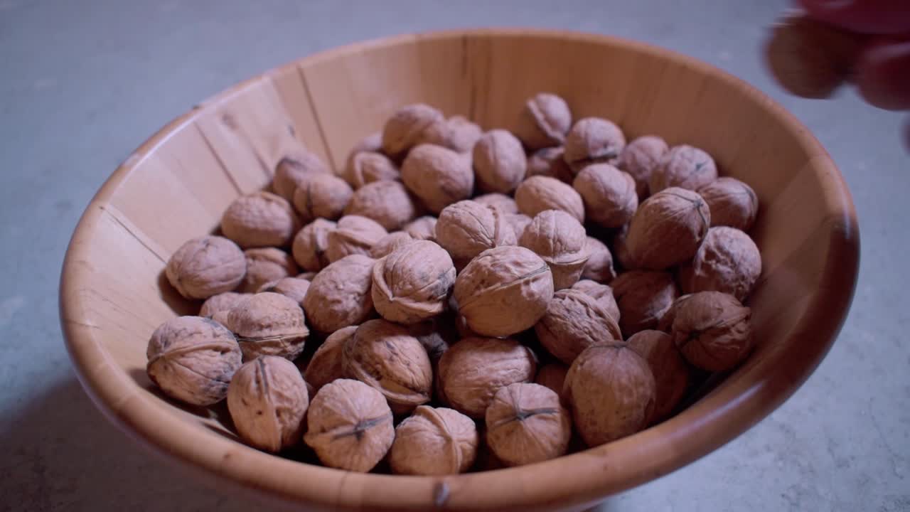 Dried walnuts in a wooden bowl-11