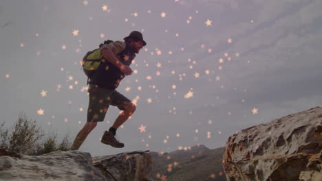 male hiker climbing rocky hillside under star-like lights, showcasing health data graphics