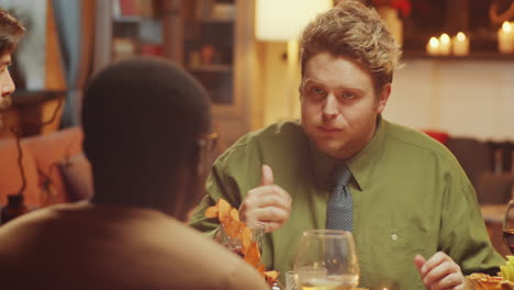 three men having dinner