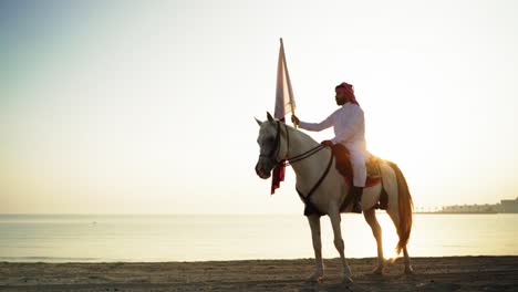 a knight on horse holding qatar flag near the sea-7