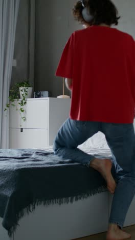 woman in bedroom working and getting ready