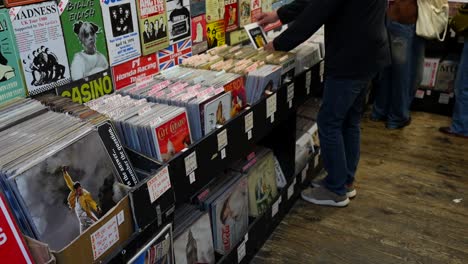 browsing vinyl records and collectibles in a record store