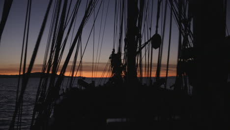 1700s sailing ship underway at sunset