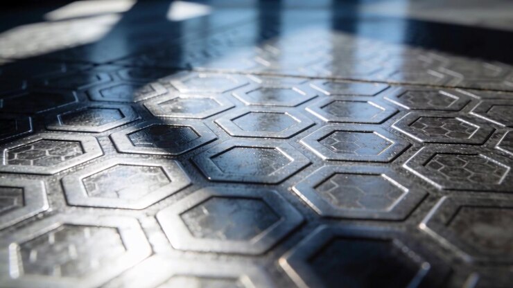 Moving shadow bands from sun crossing hex tile floor in room, revealing edges, dust, reflections