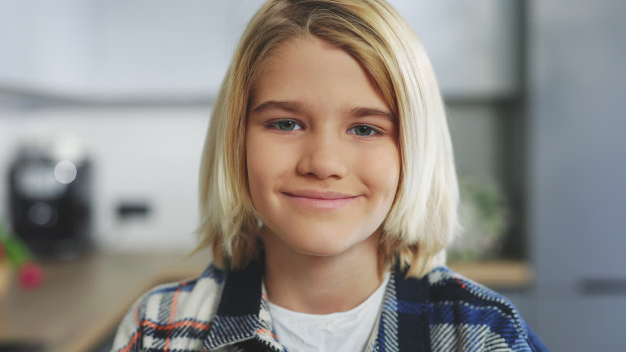 Portrait of a Smiling Girl in a Kitchen