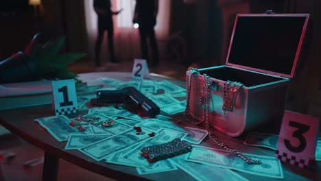 closeup shot of the table with evidence numbers jewellery gun and blood on the money bills in the crime scene creative concept closeup shot of the table in the dark apartment with signs of murder money bills with blood handgun and jewellery with evidence numbers laying on the table