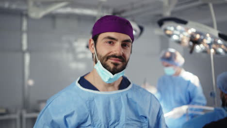 smiling surgeon in operating room