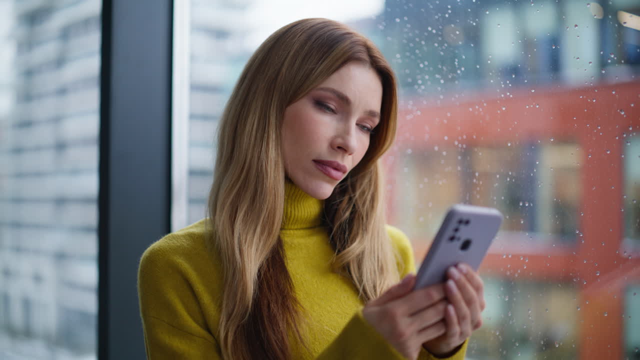 Calm freelancer looking mobile phone receiving notification at home closeup