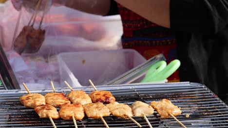 sequential preparation of skewered meat on a grill