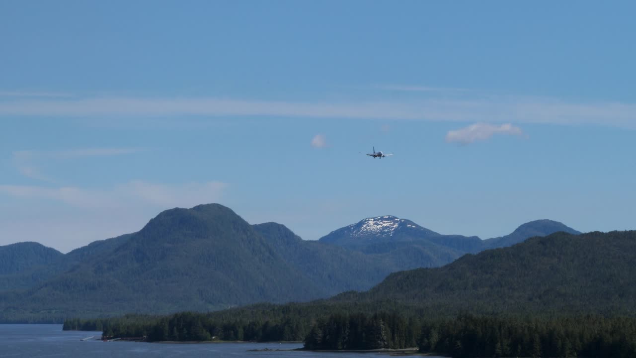 Commercial airplane landing on Ketchikan International Airport, located on Gravina Island across the Tongass Narrows, Alaska.