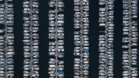 slow descending shot showing the rows of docked yachts in shilshole bay marina, seattle