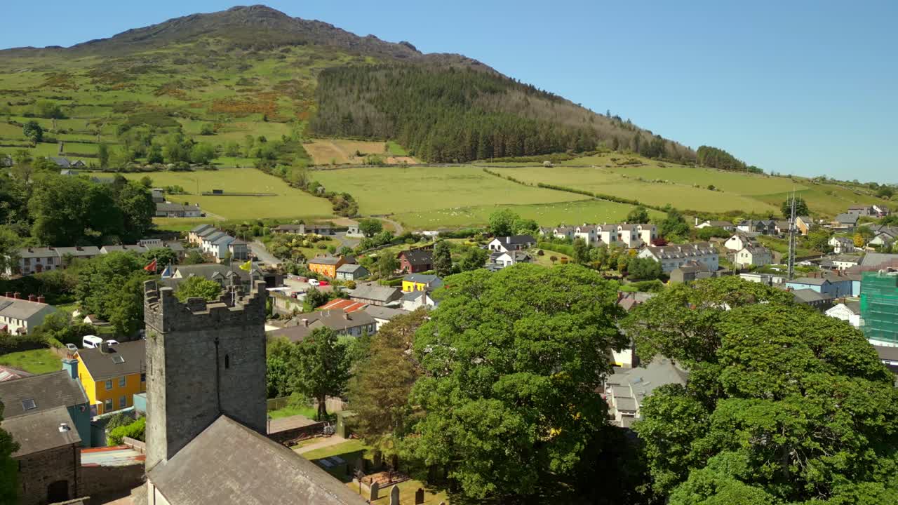 Advancing aerial video of The Church of the Holy Trinity in Carlingford, County Louth, Ireland on a bright and sunny day. Filmed in 4K, 60FPS and with Rec709 color.
