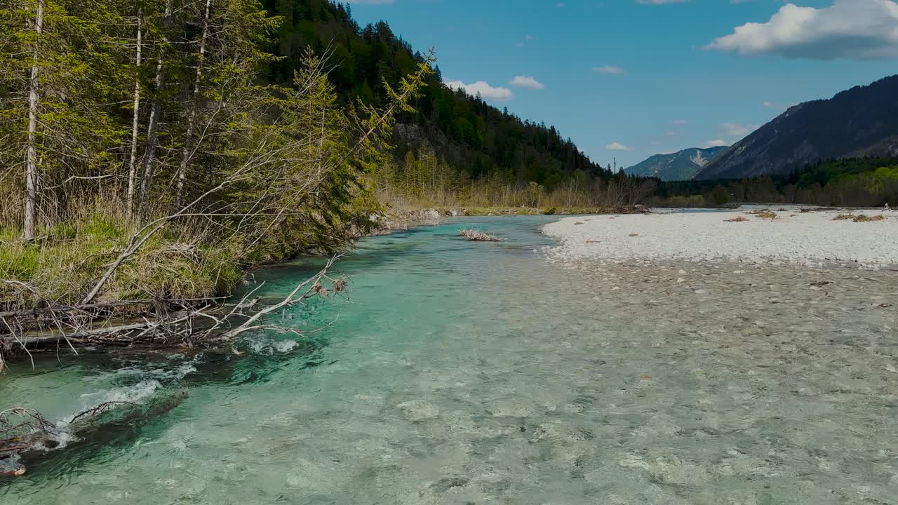 Pristine Isar river in alpine valley, pebble beach, forested mountains, Wallgau-Vorderriss area, Bavaria