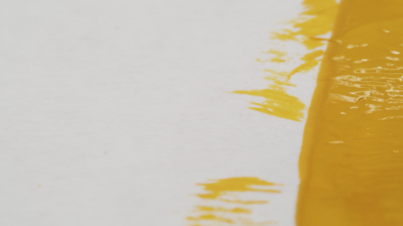 Abstract yellow paint on white surface