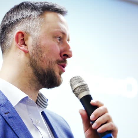 businessman speaking at a podium in a conference or seminar